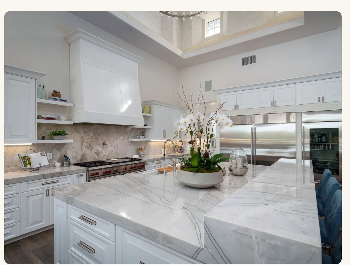 White marble kitchen with orchids centerpiece